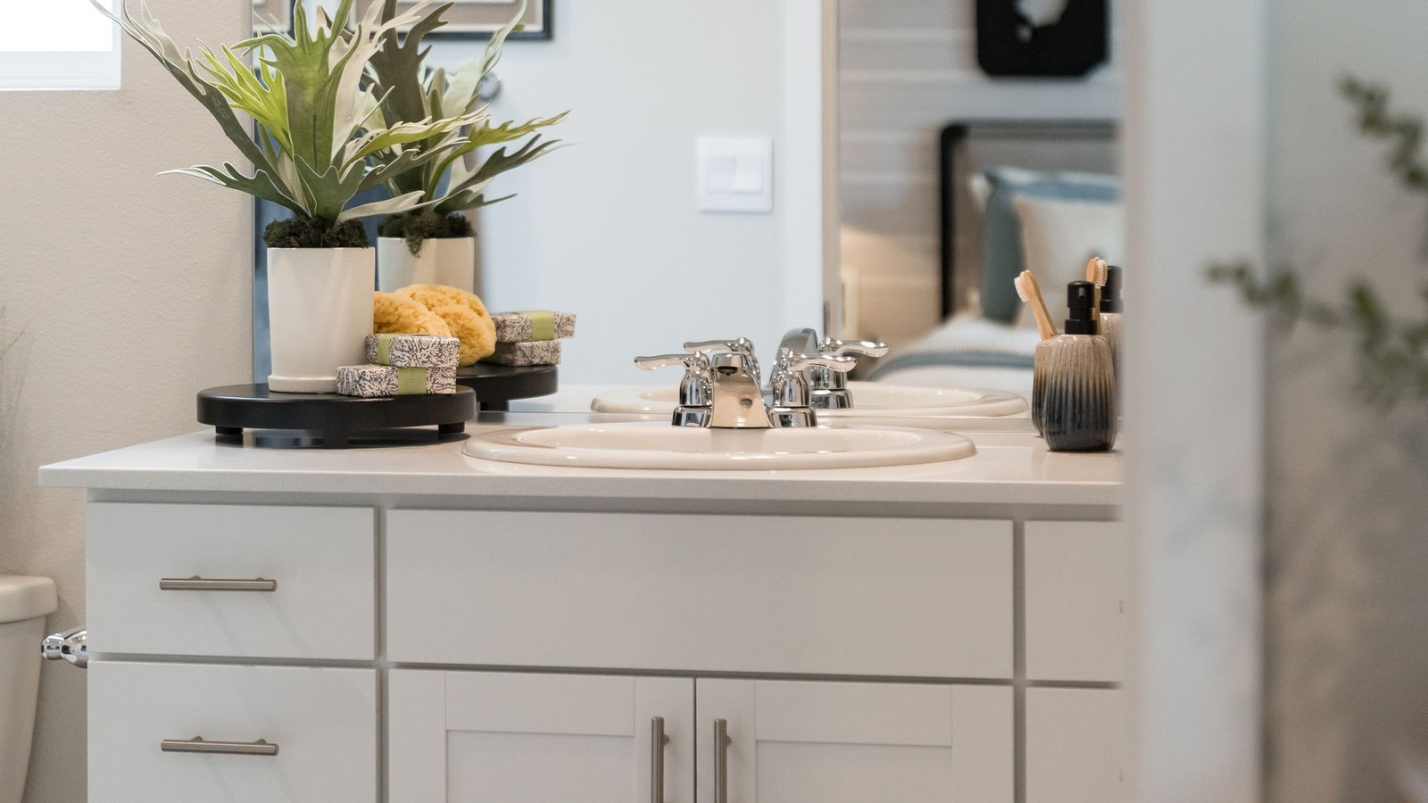 Primary bathroom with quartz counters and a walk-in shower