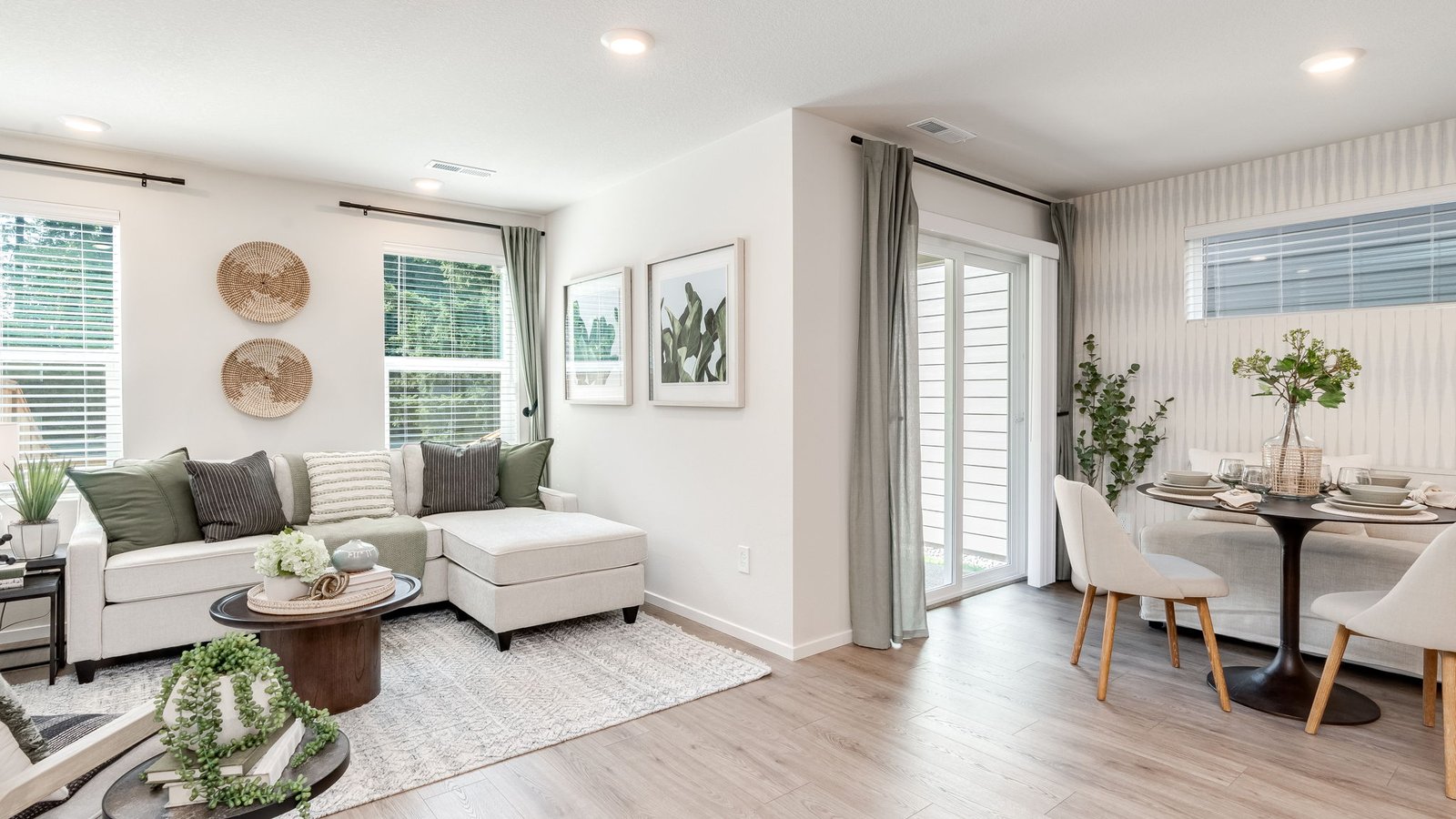 Great room with laminate flooring and an electric fireplace