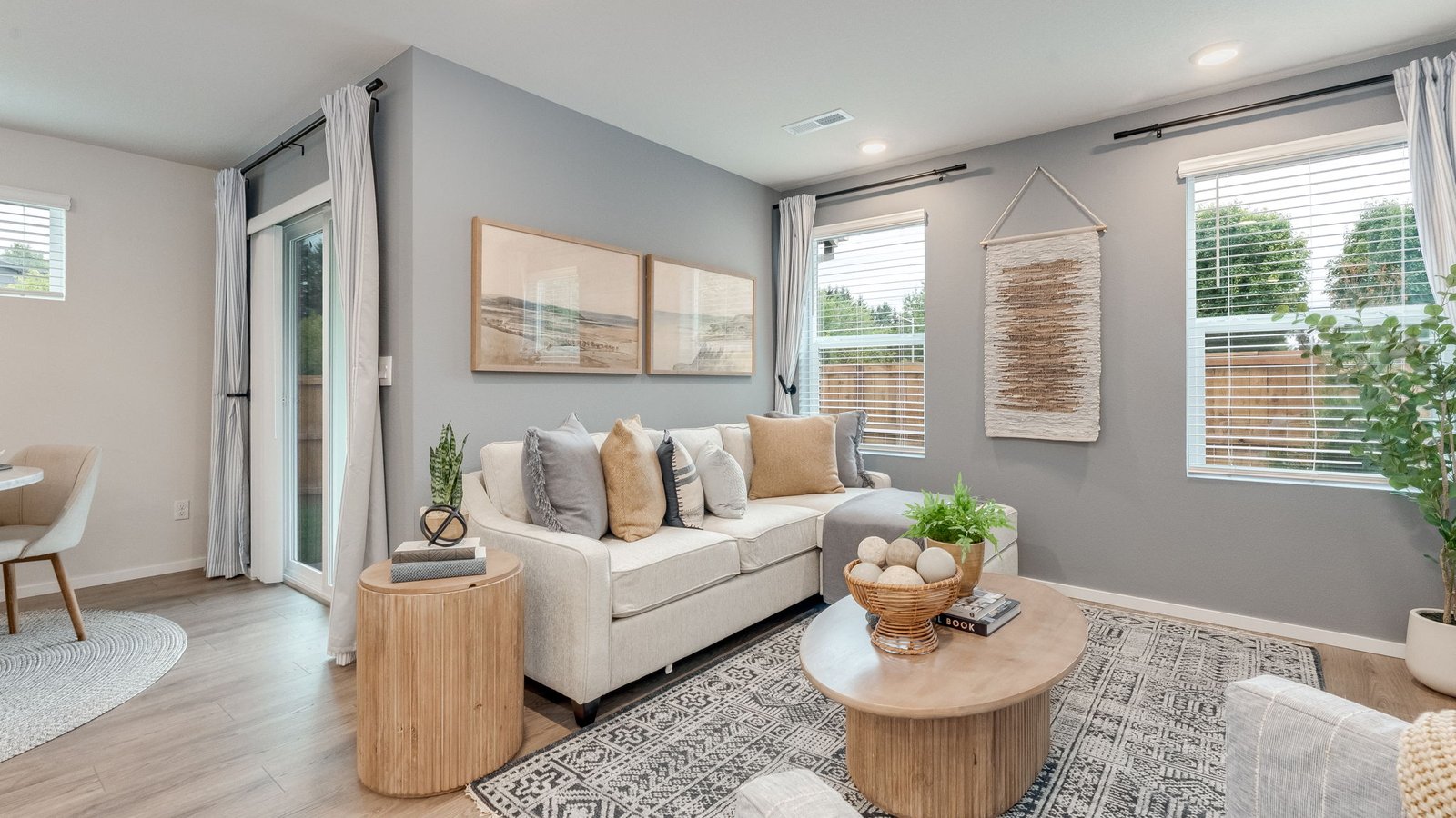 Great room with laminate flooring and an electric fireplace