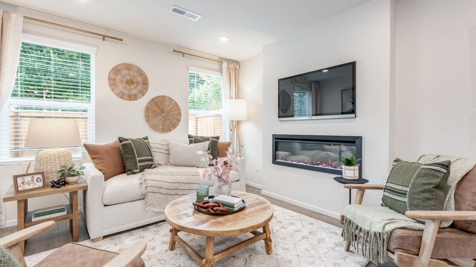 Great room with laminate flooring and an electric fireplace