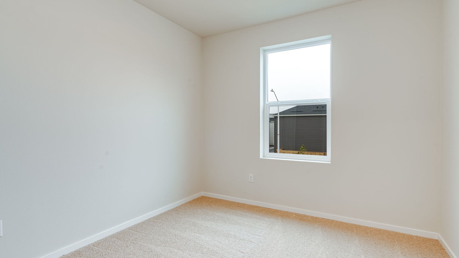 Bedroom with wall-to-wall carpet and a closet