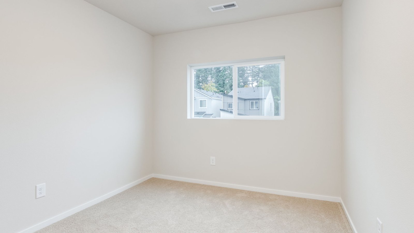 Bedroom with wall-to-wall carpet and a closet