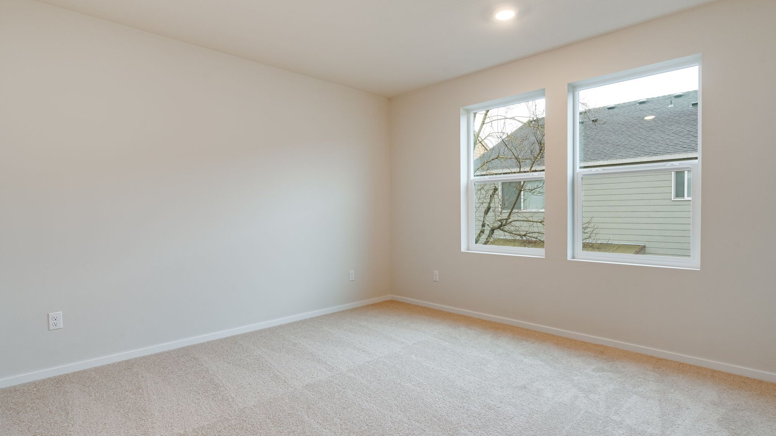Primary bedroom with wall-to-wall carpet, a walk-in closet and an attached bathroom