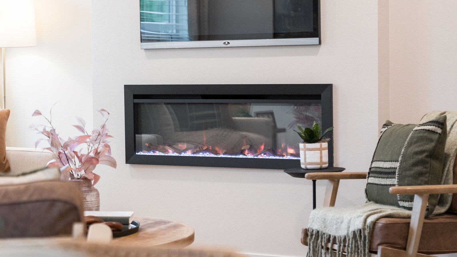 Great room with laminate flooring and an electric fireplace