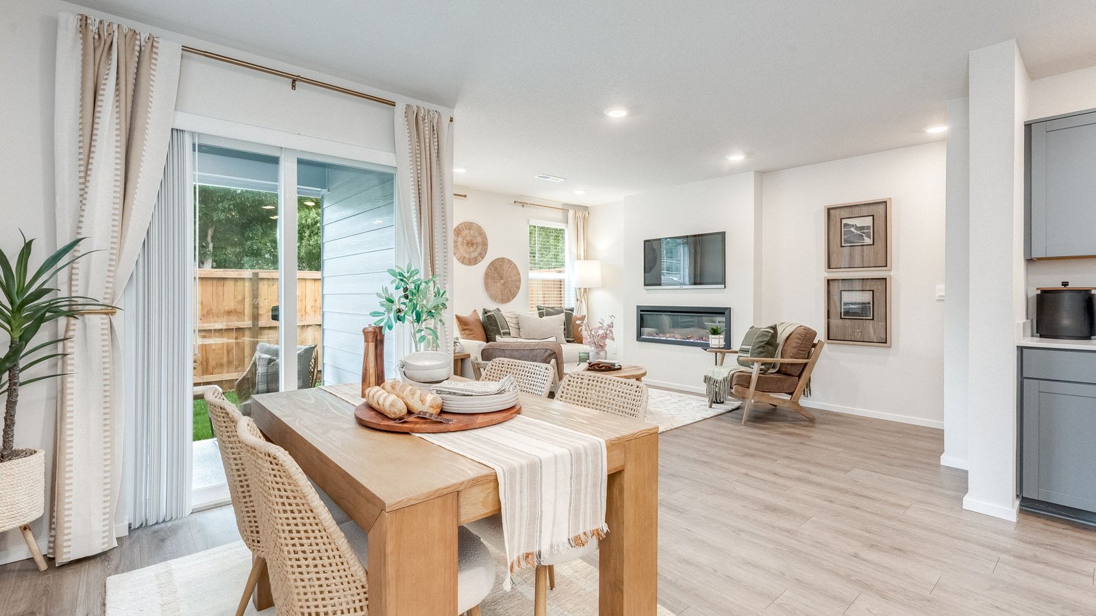 Great room with laminate flooring and an electric fireplace