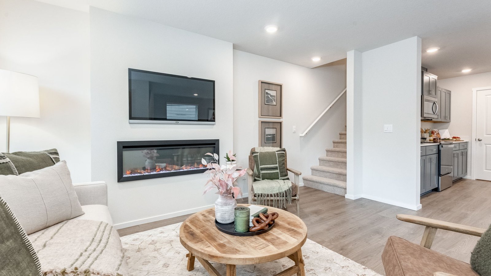 Great room with laminate flooring and an electric fireplace