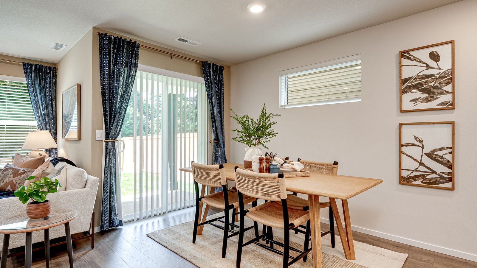 Dining area with a sliding glass door to a fenced backyard