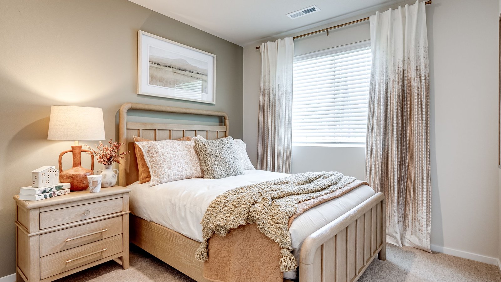 Bedroom with wall-to-wall carpet and a closet