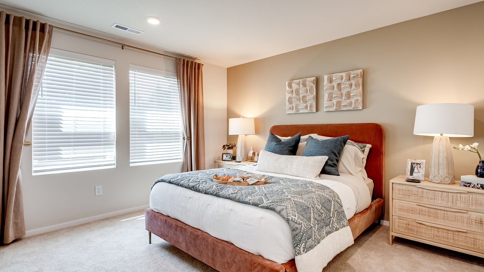 Primary bedroom with wall-to-wall carpet, a walk-in closet and an attached bathroom