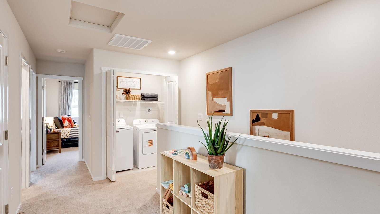 Hallway with wall-to-wall carpet