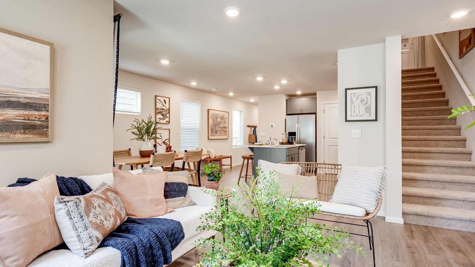 Great room with laminate flooring and an electric fireplace