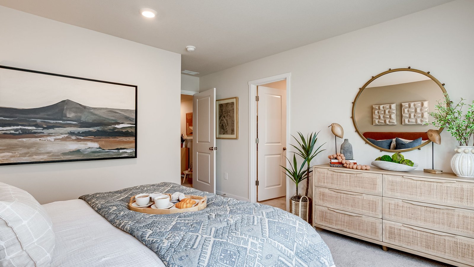 Primary bedroom with wall-to-wall carpet, a walk-in closet and an attached bathroom