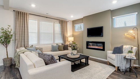Great room with laminate flooring and an electric fireplace
