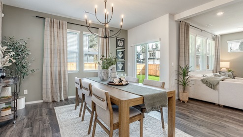 Dining area with a sliding glass door to a fenced backyard