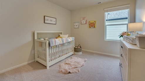 Bedroom with wall-to-wall carpet and a closet