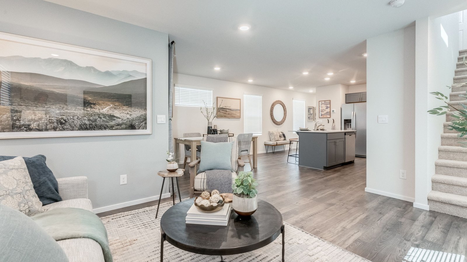 Great room with laminate flooring and an electric fireplace