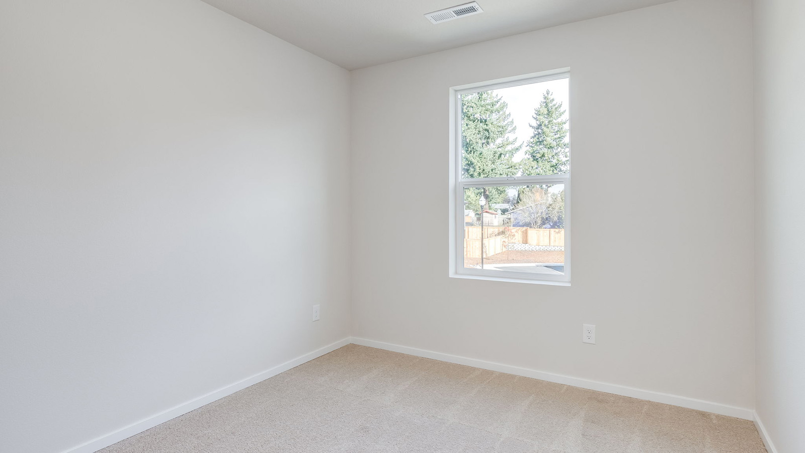 Bedroom with wall-to-wall carpet and a closet