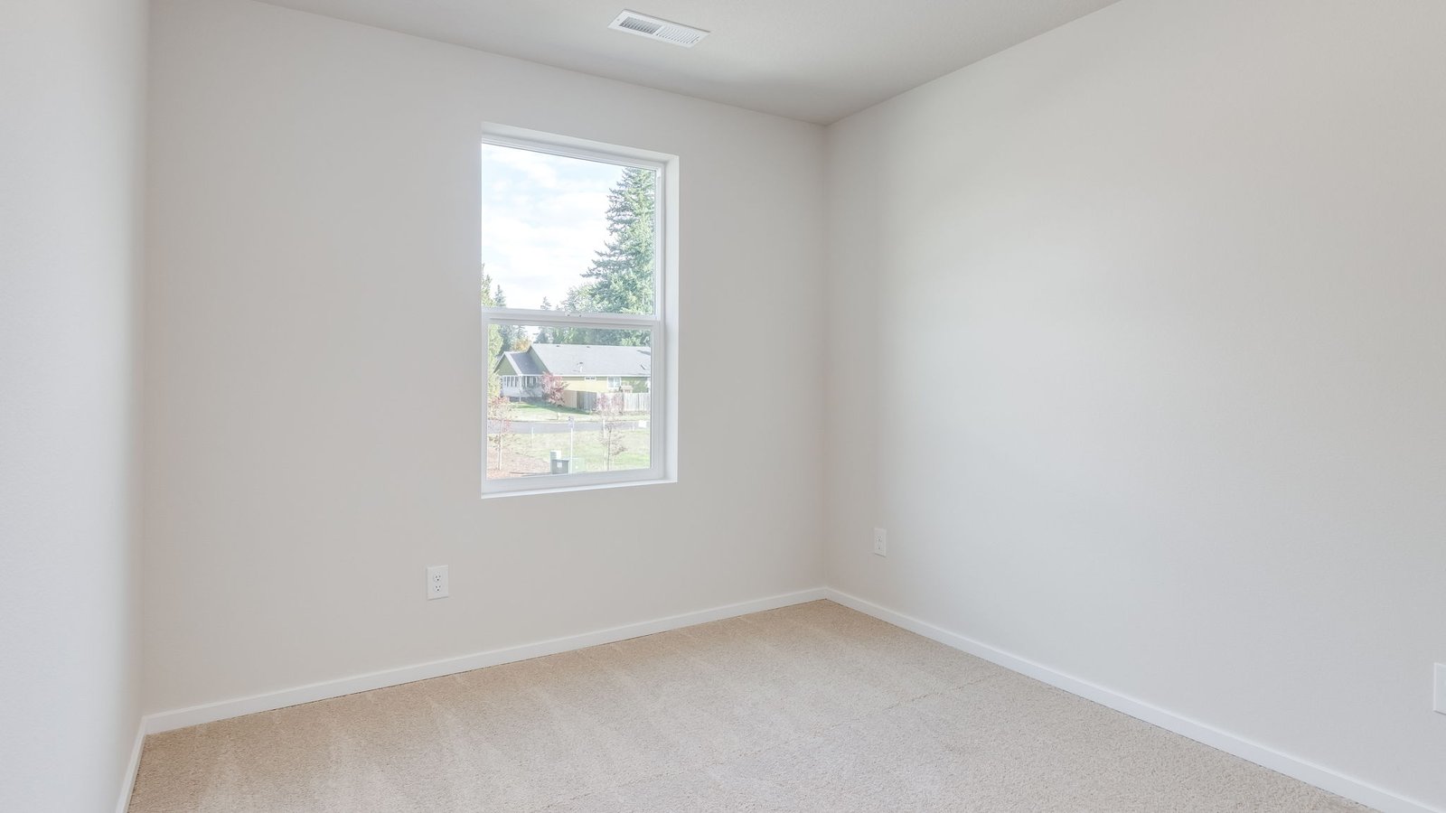 Bedroom with wall-to-wall carpet and a closet