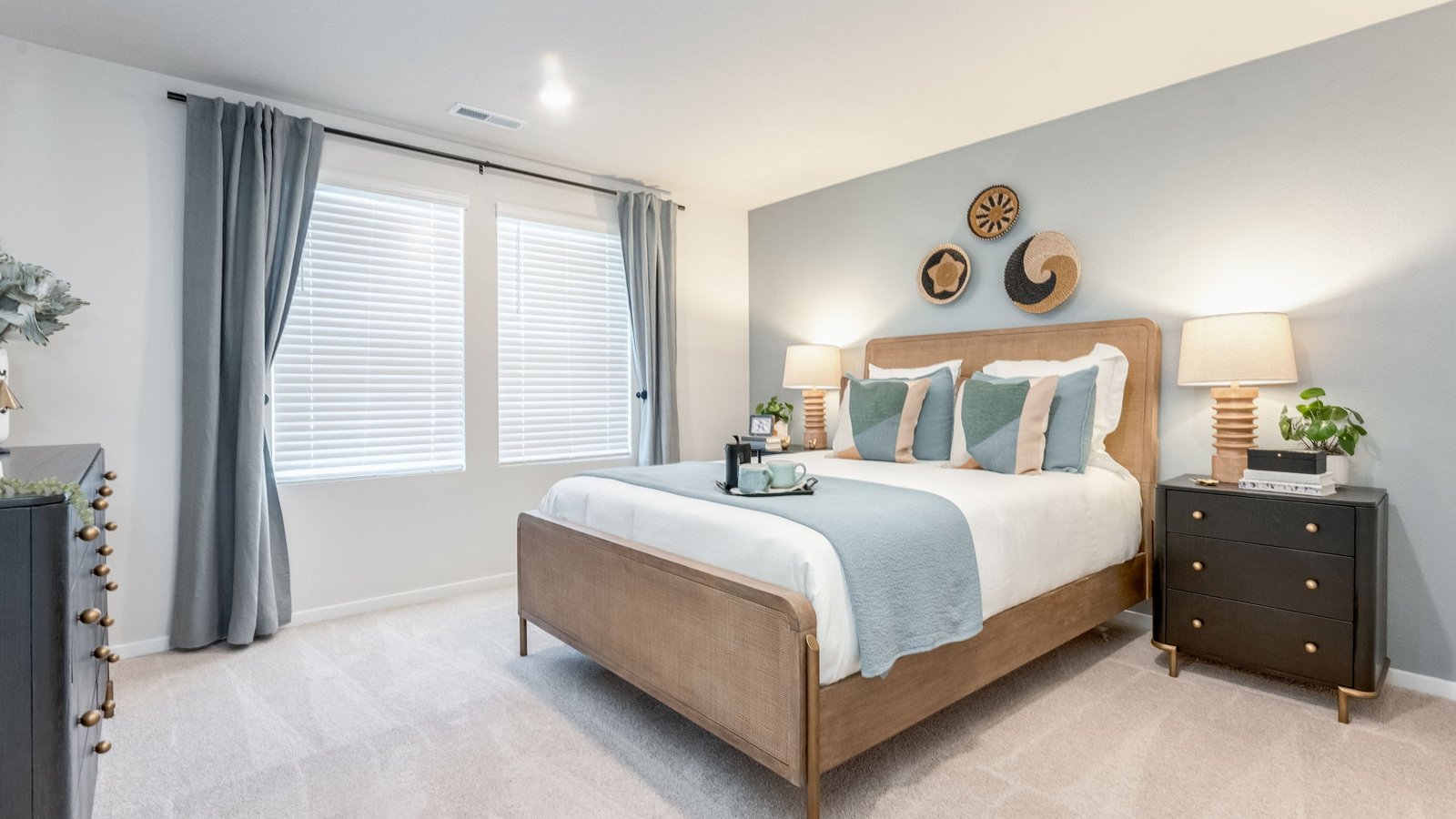 Primary bedroom with wall-to-wall carpet, a walk-in closet and an attached bathroom