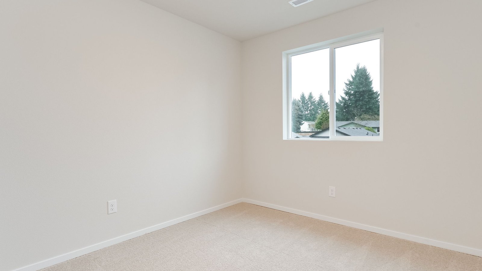 Bedroom with wall-to-wall carpet and a closet