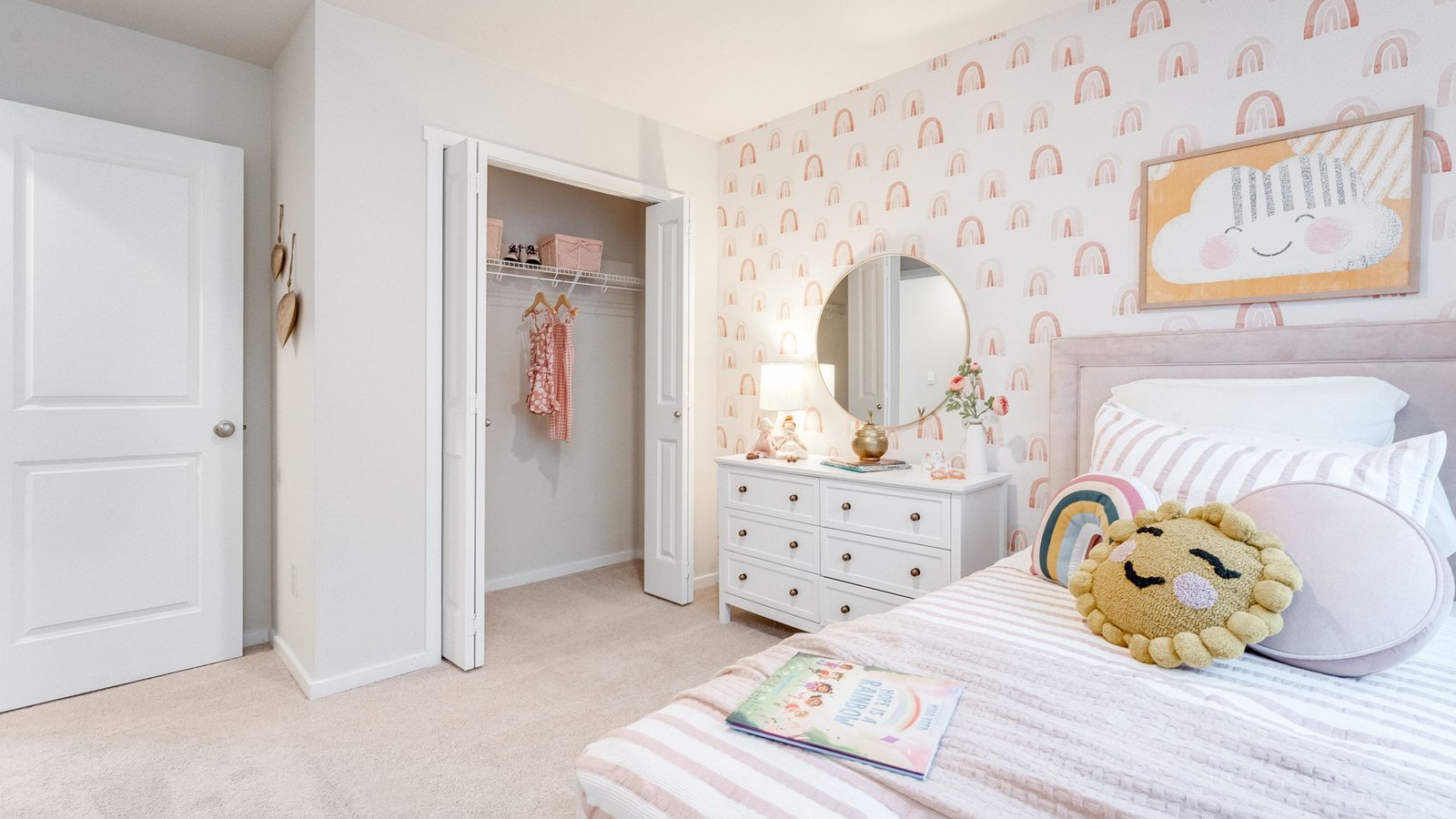 Bedroom with wall-to-wall carpet and a closet