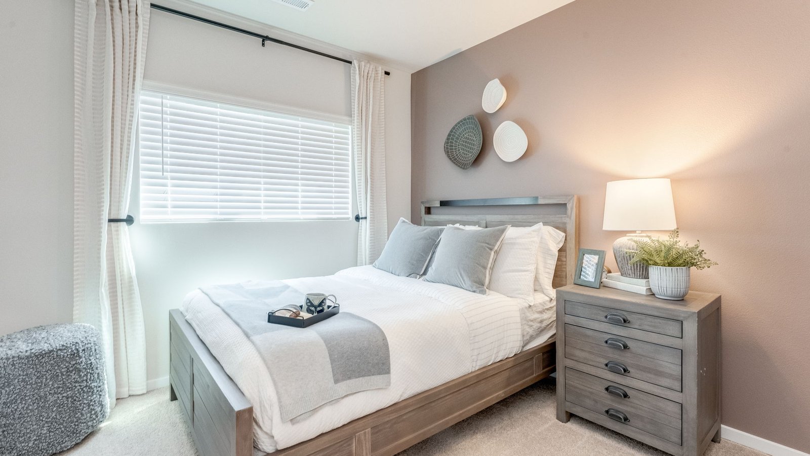 Bedroom with wall-to-wall carpet and a closet