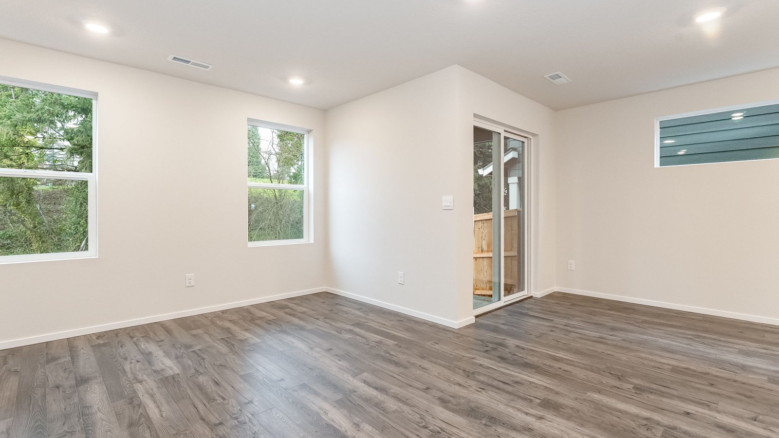 Great room with laminate flooring and an electric fireplace