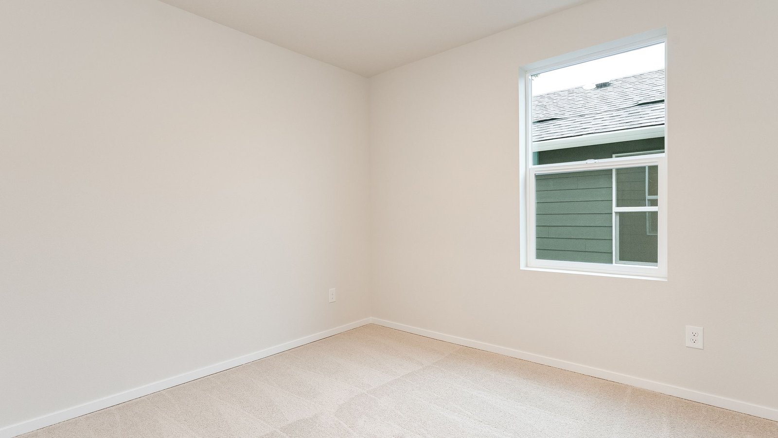 Bedroom with wall-to-wall carpet and a closet
