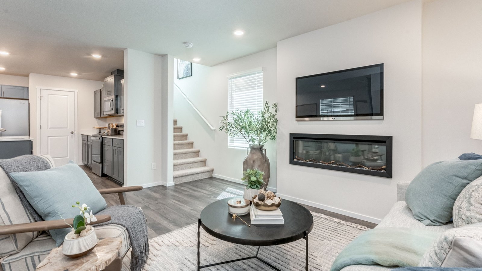 Great room with laminate flooring and an electric fireplace