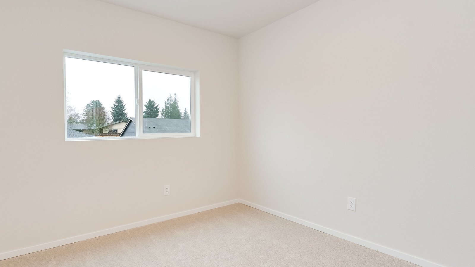 Bedroom with wall-to-wall carpet and a closet