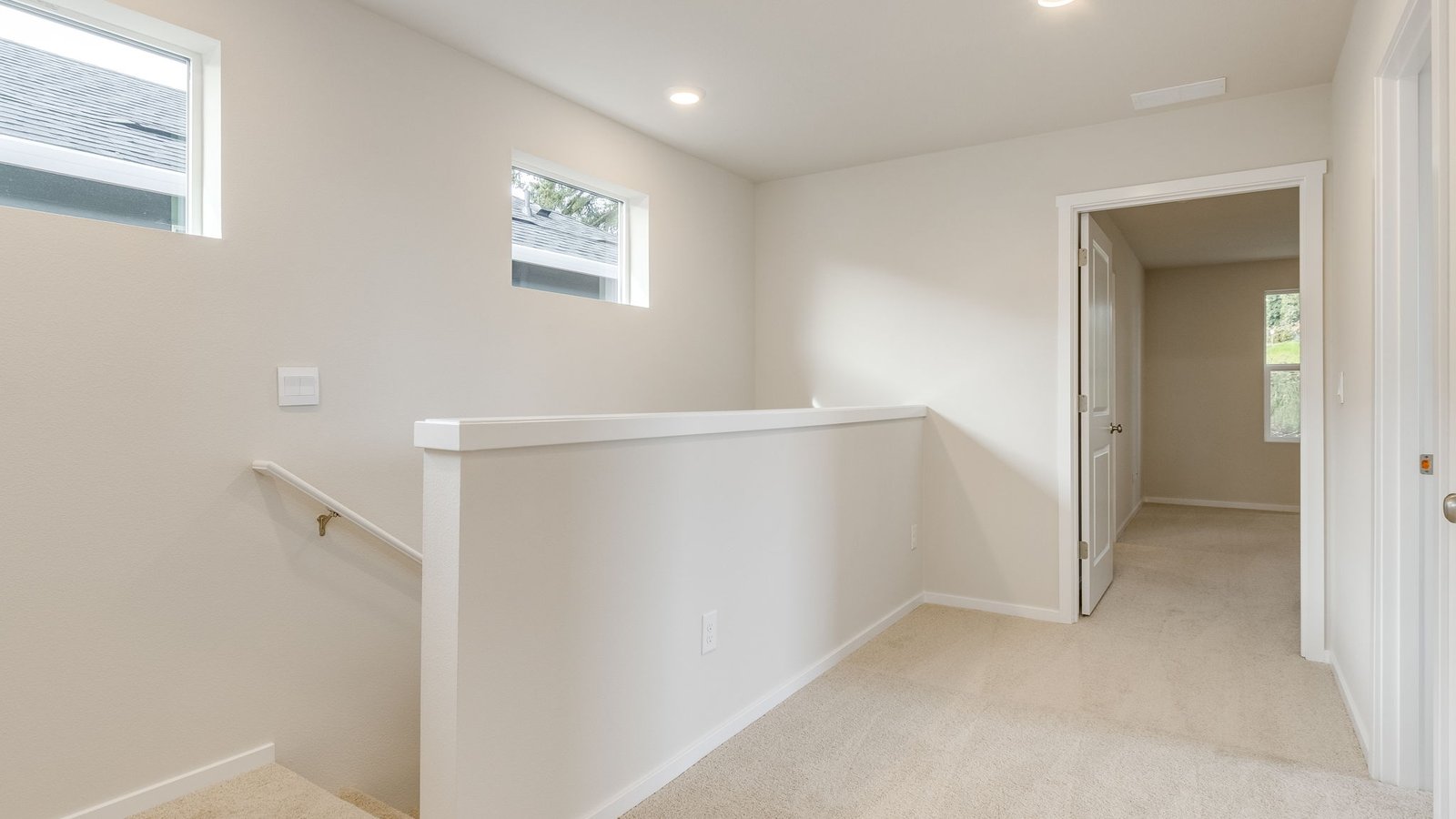 Hallway with wall-to-wall carpet