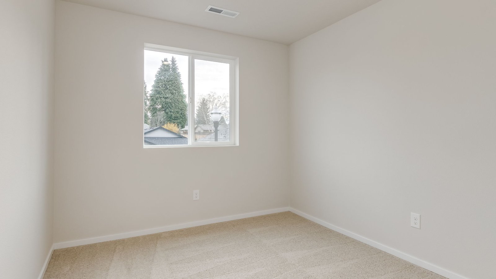 Bedroom with wall-to-wall carpet and a closet