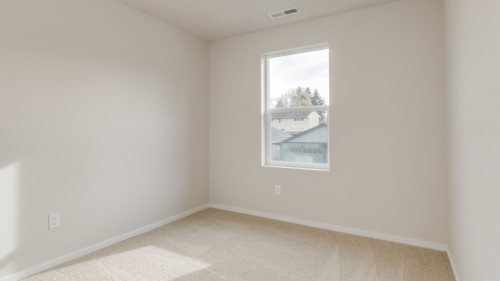 Bedroom with wall-to-wall carpet and a closet
