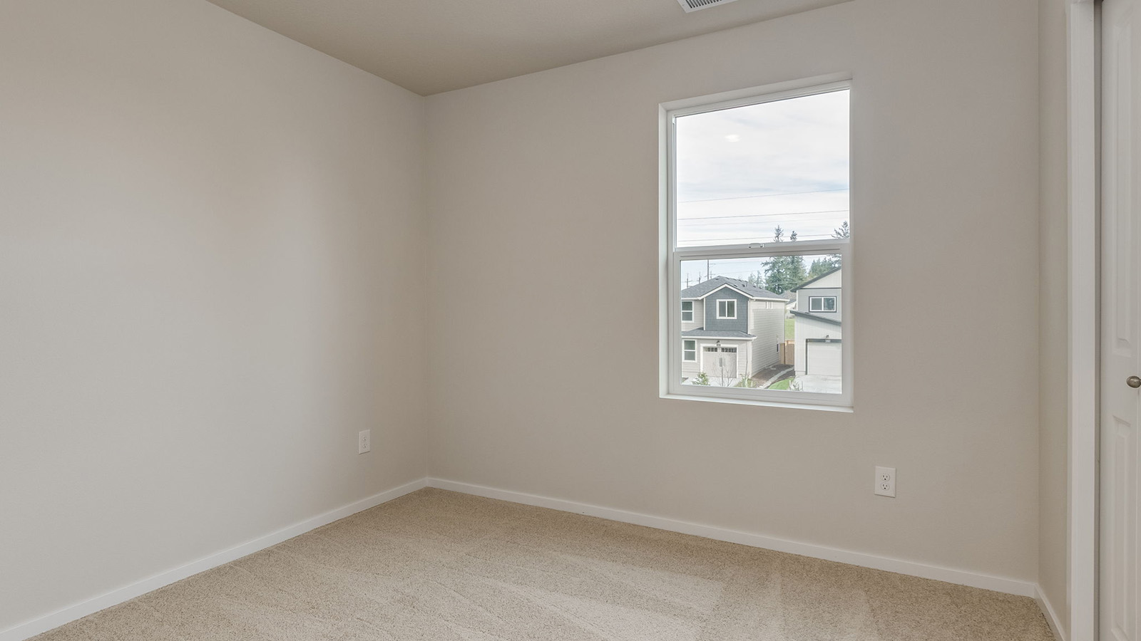 Bedroom with wall-to-wall carpet and a closet