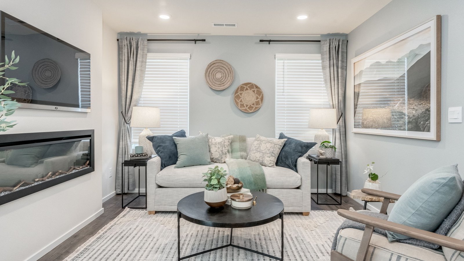 Great room with laminate flooring and an electric fireplace