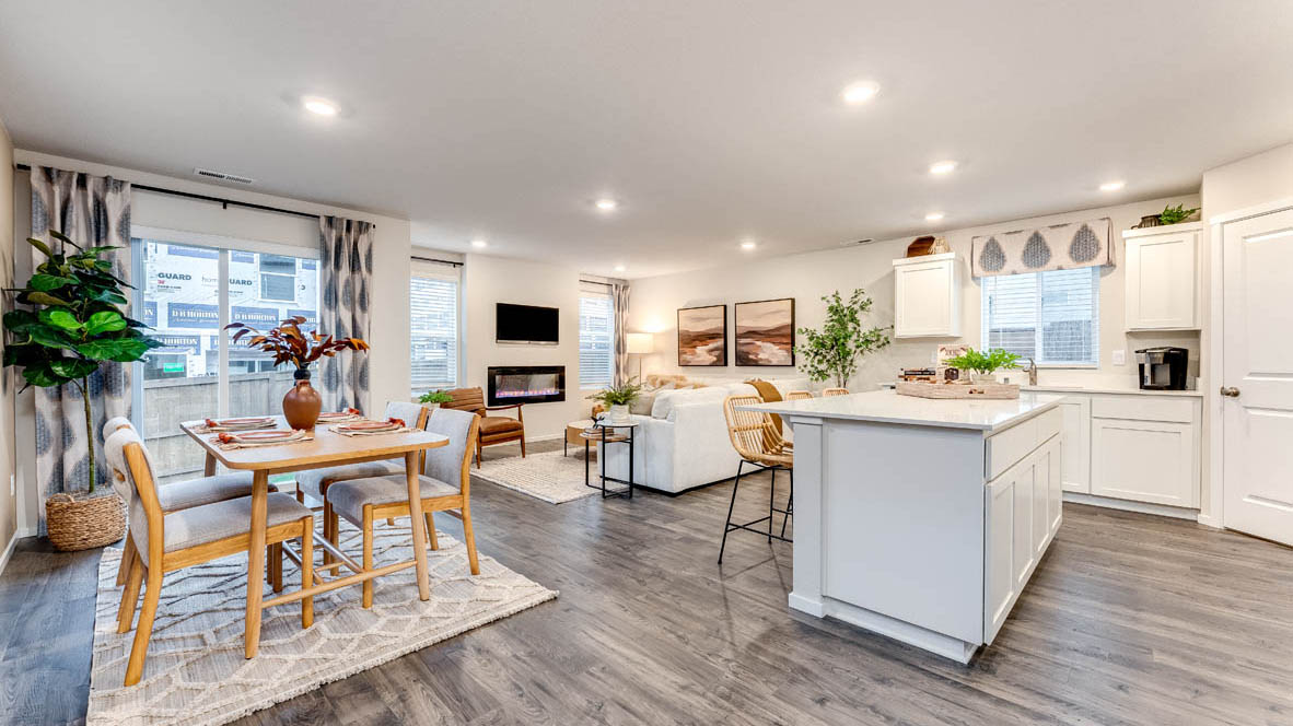 Great room with laminate flooring and an electric fireplace