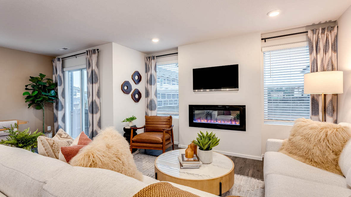 Great room with laminate flooring and an electric fireplace