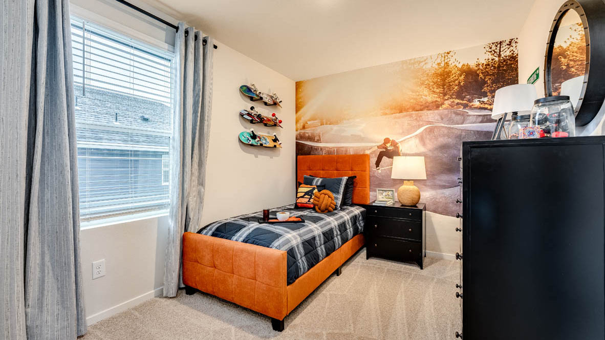 Bedroom with wall-to-wall carpet and a closet