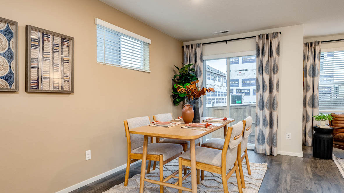 Dining area with a sliding glass door to a fenced backyard