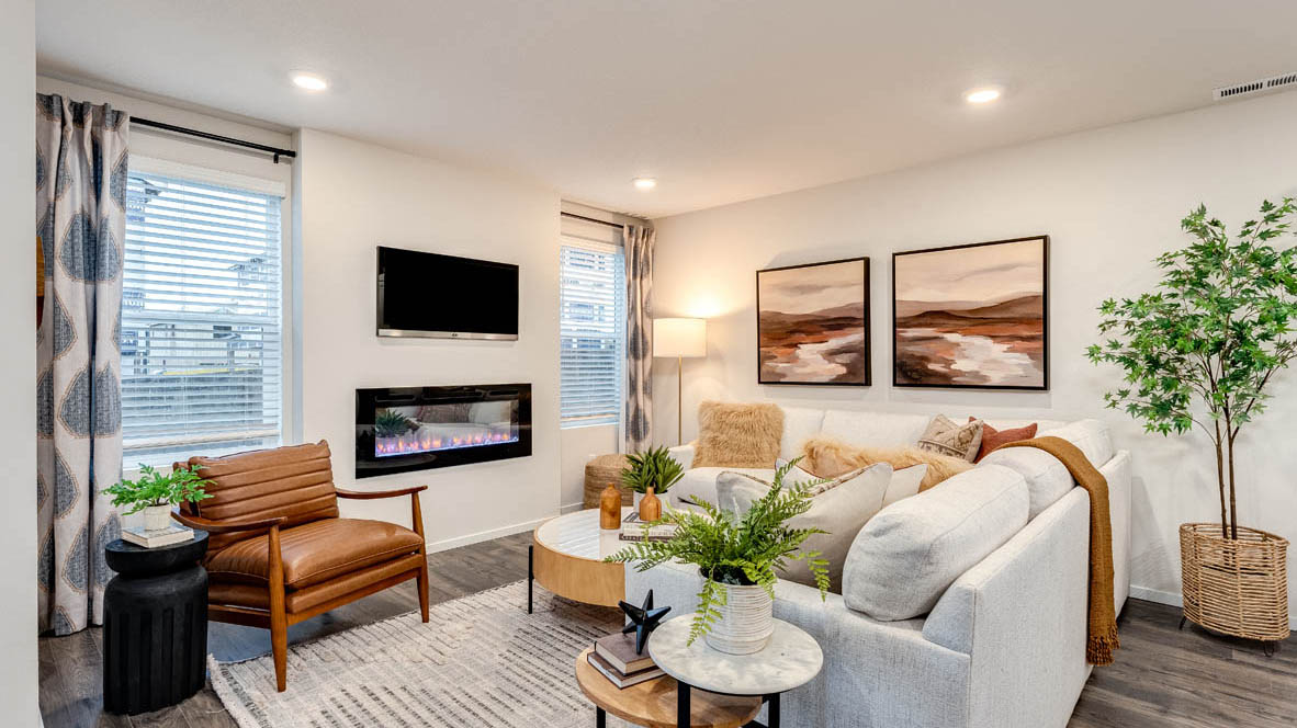 Great room with laminate flooring and an electric fireplace