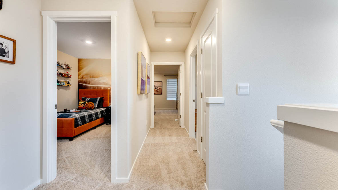 Hallway with wall-to-wall carpet