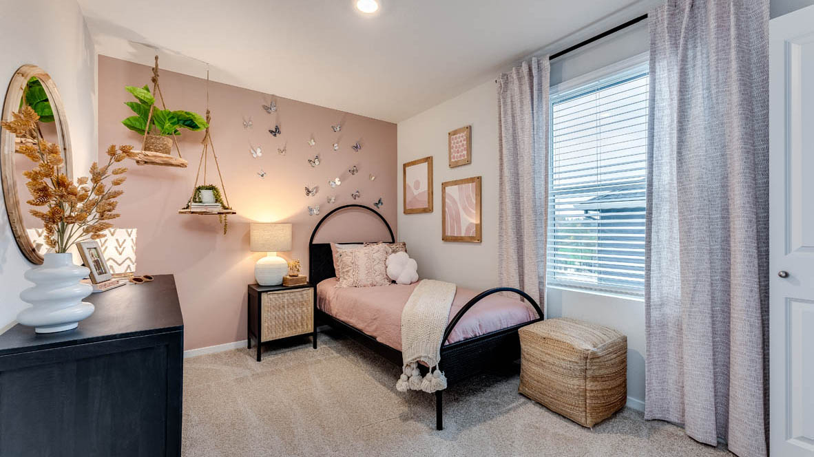 Bedroom with wall-to-wall carpet and a closet