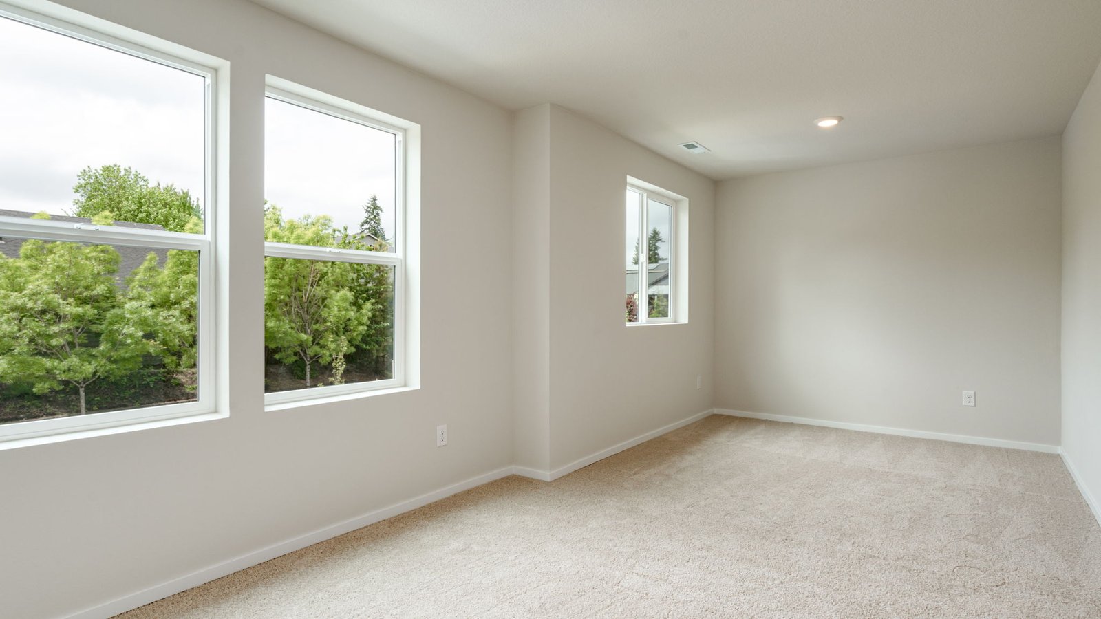 Bedroom with wall-to-wall carpet and a closet