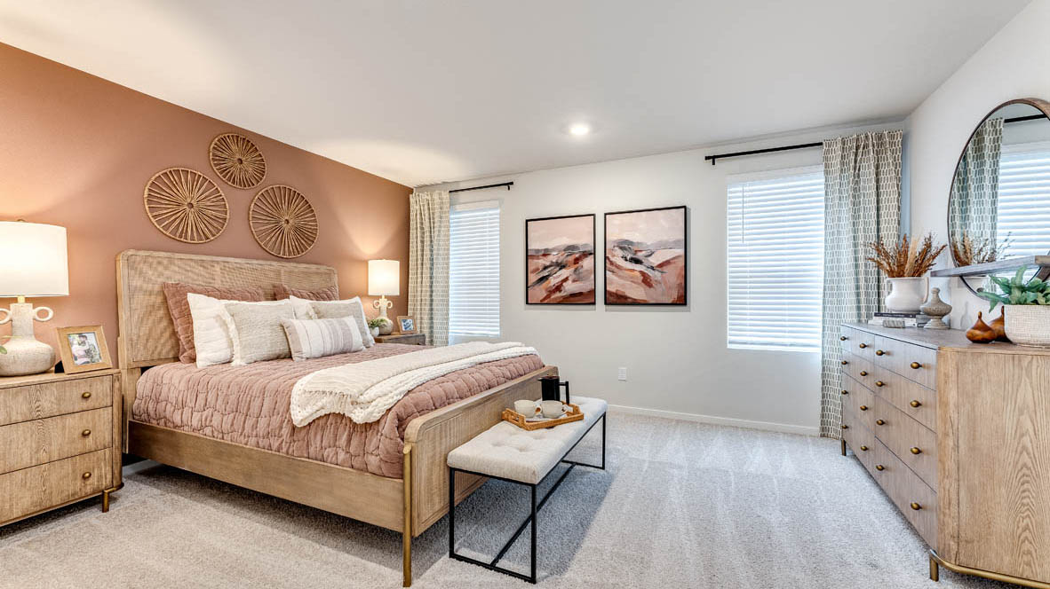 Primary bedroom with wall-to-wall carpet, a walk-in closet and an attached bathroom