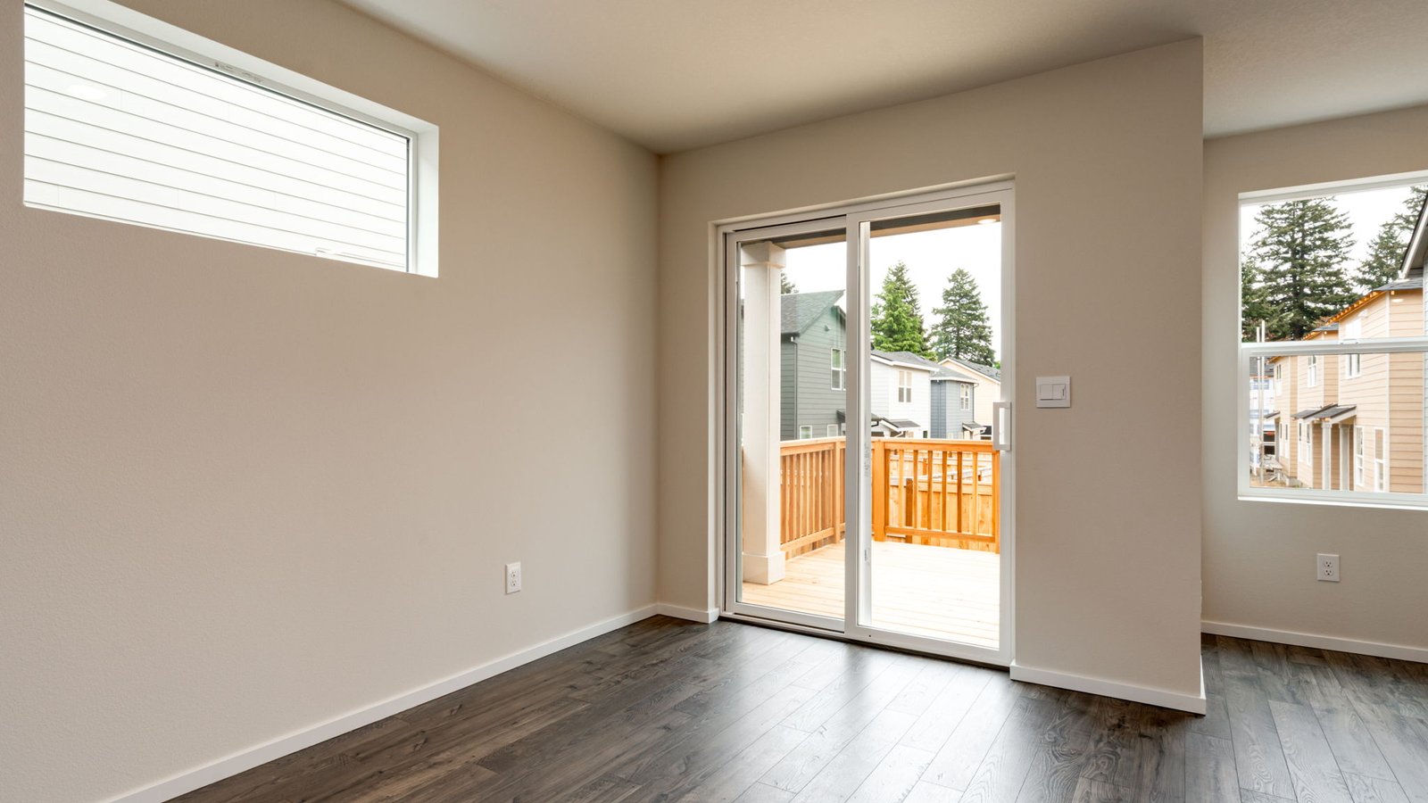 Dining area with a sliding glass door to a fenced backyard