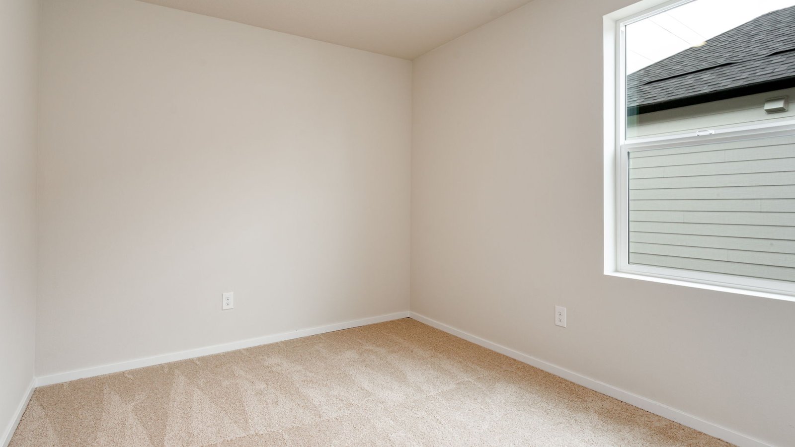 Bedroom with wall-to-wall carpet and a closet