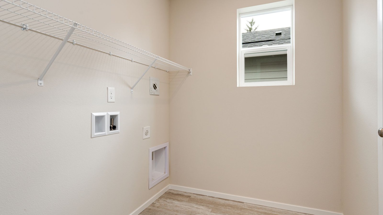 Laundry room with wire shelves and washer and dryer hookups