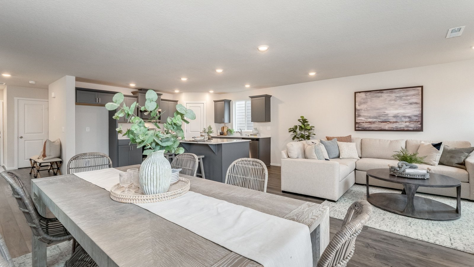 Great room with laminate flooring and an electric fireplace