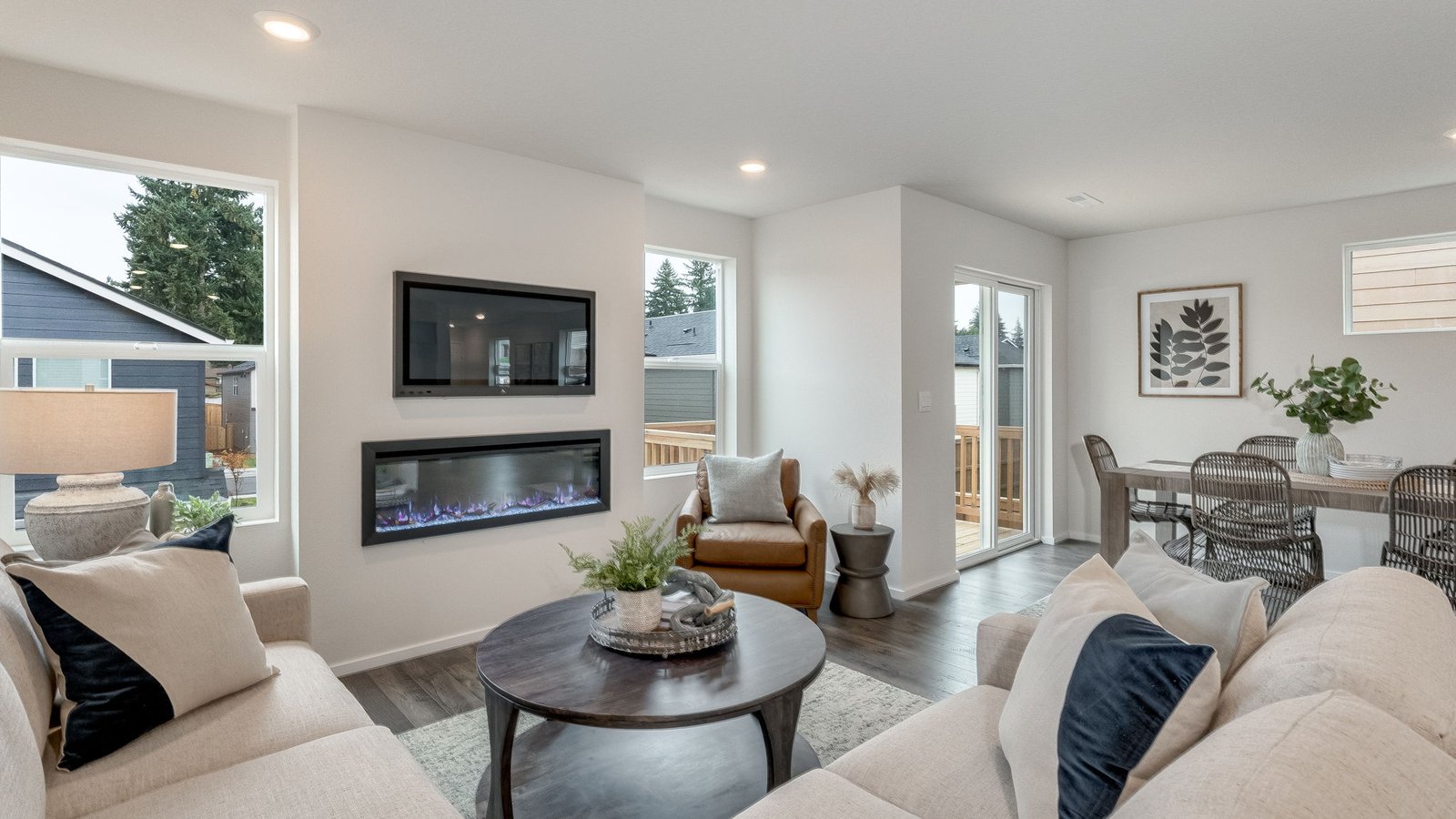 Great room with laminate flooring and an electric fireplace