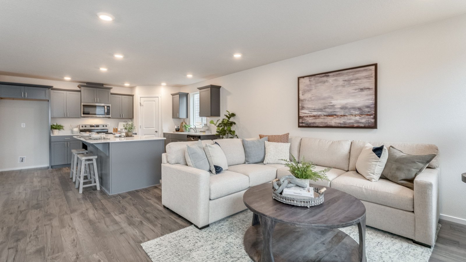 Great room with laminate flooring and an electric fireplace